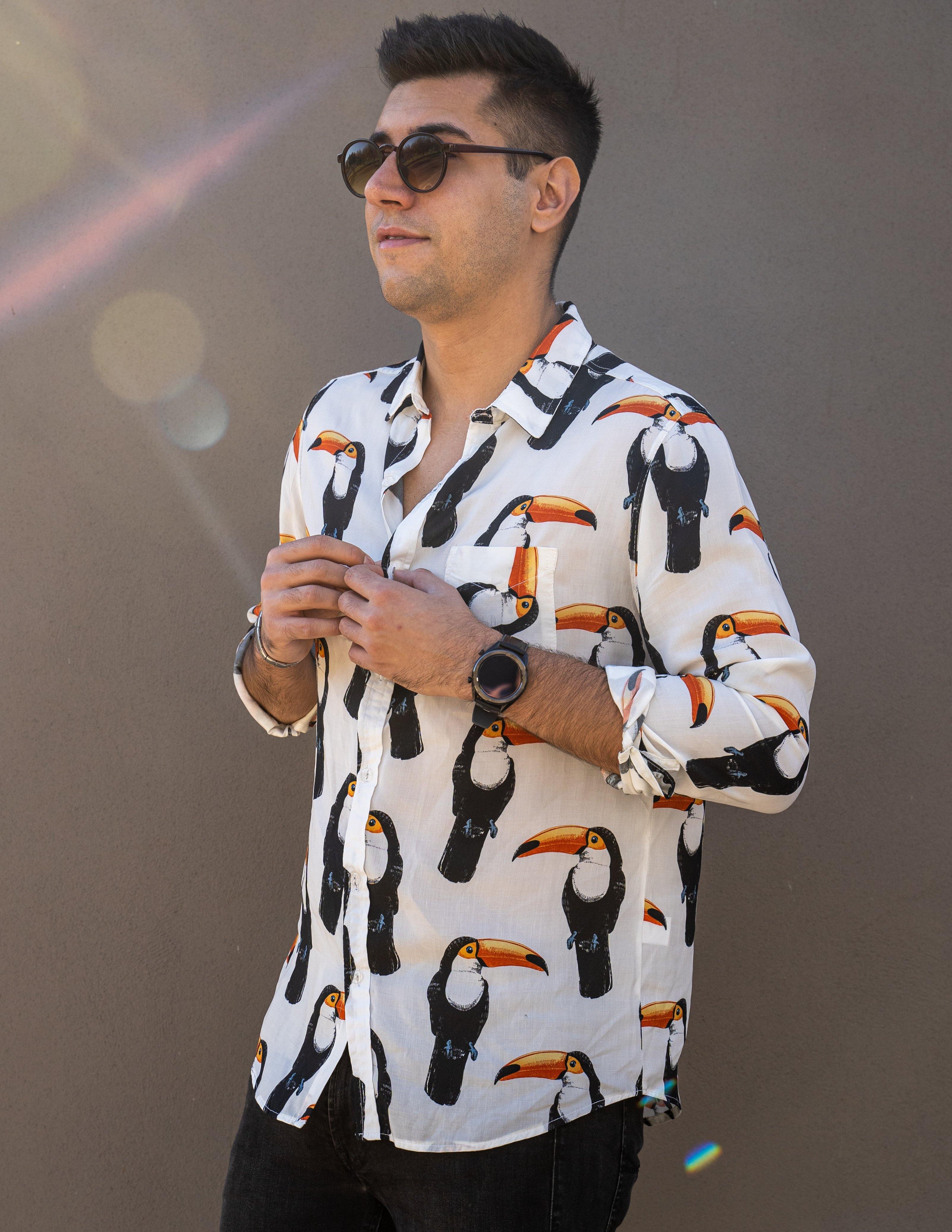 Long Sleeve Shirt - ToucanStrange ParadiseStrange Paradise
Men's Long Sleeve Shirt - Toucan Do It is a slim fit shirt with button up fastening and a single chest pocket. The shirt showcases a smart casual look and is pairedMen's Long Sleeve Shirt - Toucan Do It