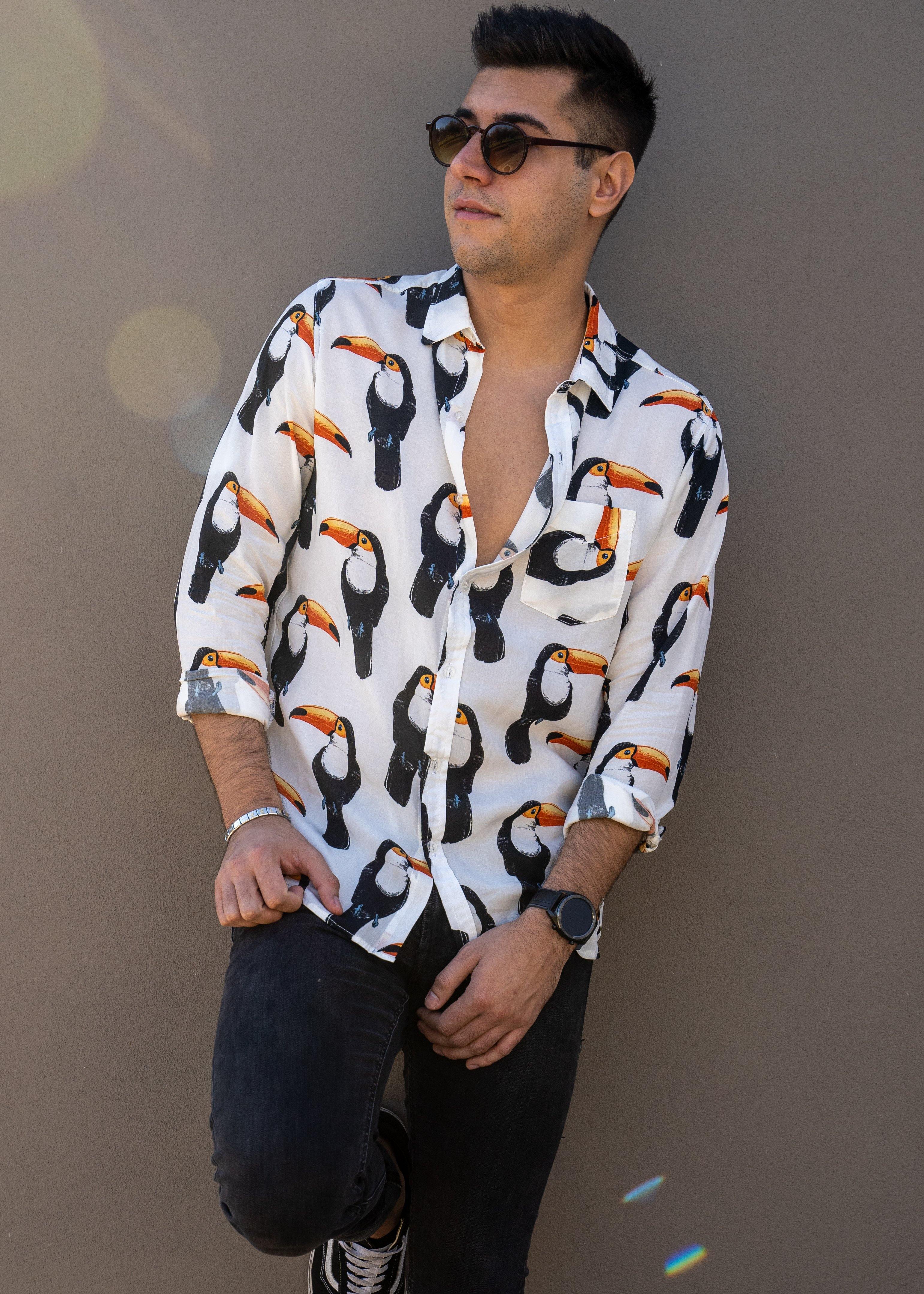 Long Sleeve Shirt - ToucanStrange ParadiseStrange Paradise
Men's Long Sleeve Shirt - Toucan Do It is a slim fit shirt with button up fastening and a single chest pocket. The shirt showcases a smart casual look and is pairedMen's Long Sleeve Shirt - Toucan Do It