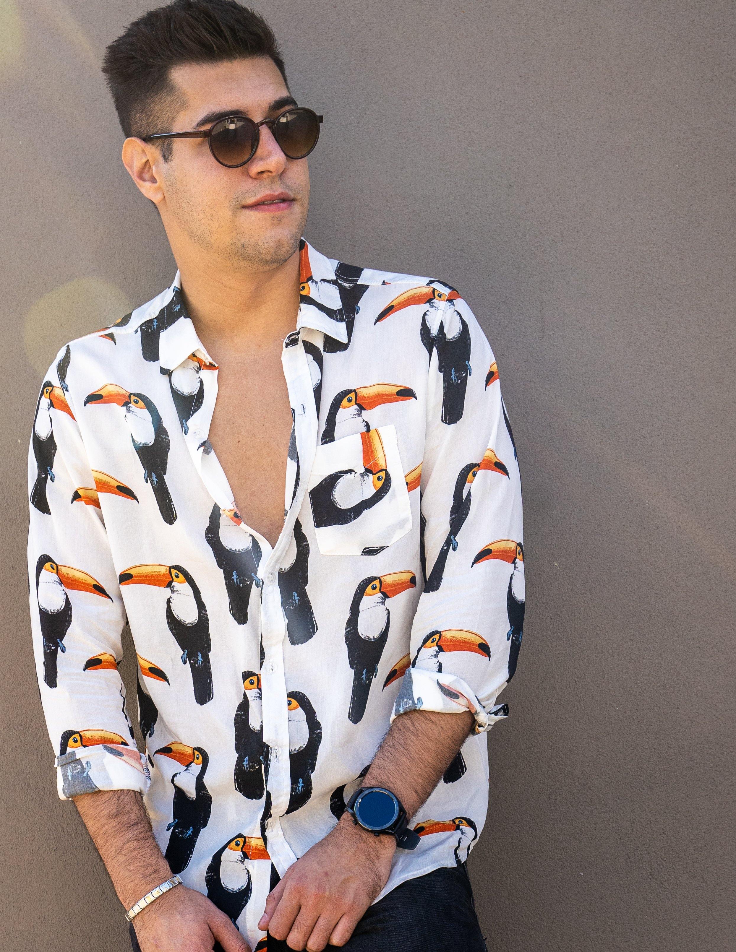 Long Sleeve Shirt - ToucanStrange ParadiseStrange Paradise
Men's Long Sleeve Shirt - Toucan Do It is a slim fit shirt with button up fastening and a single chest pocket. The shirt showcases a smart casual look and is pairedMen's Long Sleeve Shirt - Toucan Do It