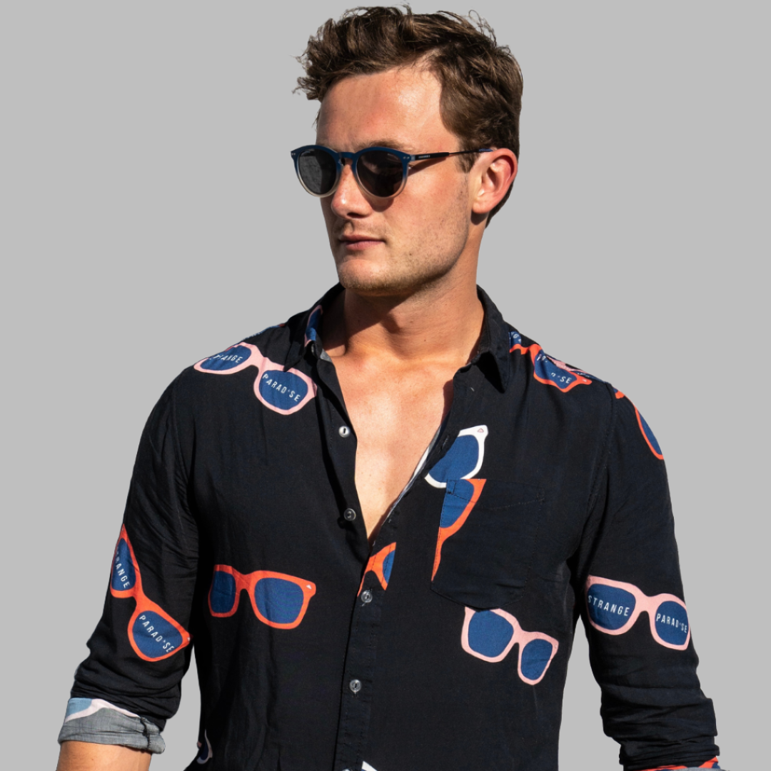 Long Sleeve Shirt - Retro ShadesStrange ParadiseStrange Paradise
Men's Long Sleeve Shirt - Retro Shades is a slim fit shirt with button up fastening and a single chest pocket. The shirt showcases a smart casual look and is pairedMen's Long Sleeve Shirt - Retro Shades