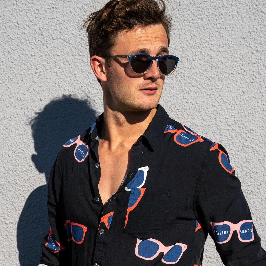 Long Sleeve Shirt - Retro ShadesStrange ParadiseStrange Paradise
Men's Long Sleeve Shirt - Retro Shades is a slim fit shirt with button up fastening and a single chest pocket. The shirt showcases a smart casual look and is pairedMen's Long Sleeve Shirt - Retro Shades