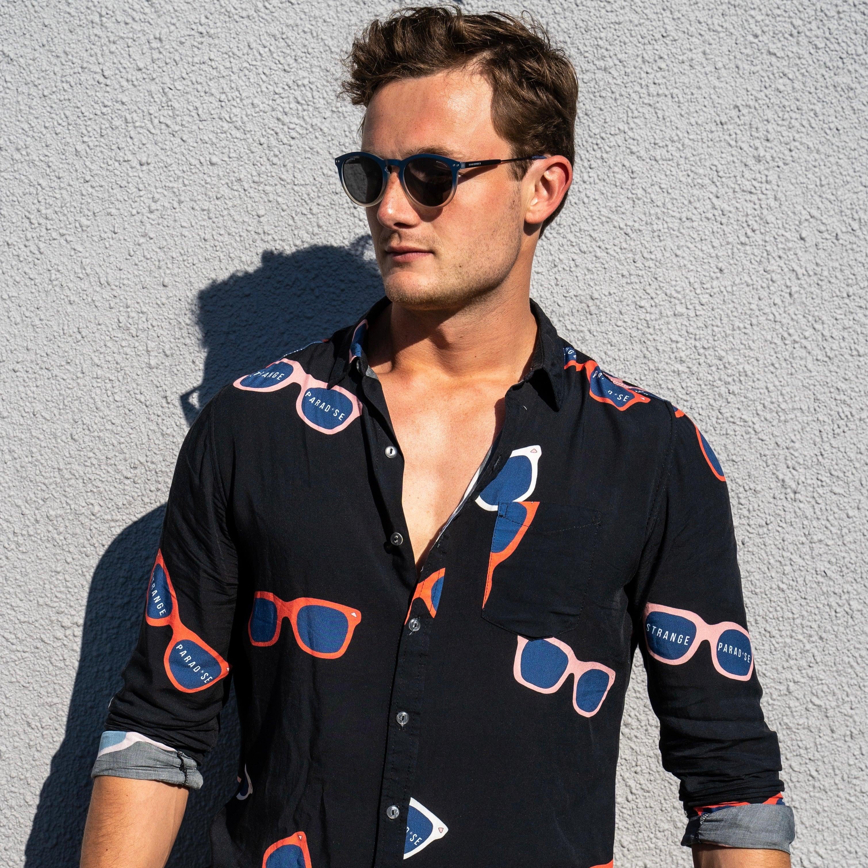 Long Sleeve Shirt - Retro ShadesStrange ParadiseStrange Paradise
Men's Long Sleeve Shirt - Retro Shades is a slim fit shirt with button up fastening and a single chest pocket. The shirt showcases a smart casual look and is pairedMen's Long Sleeve Shirt - Retro Shades